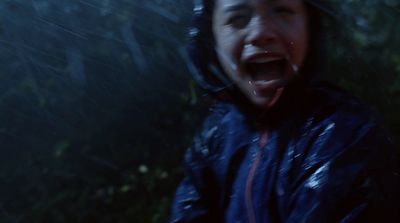 a man with his mouth open in the rain