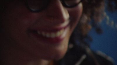 a close up of a person wearing glasses