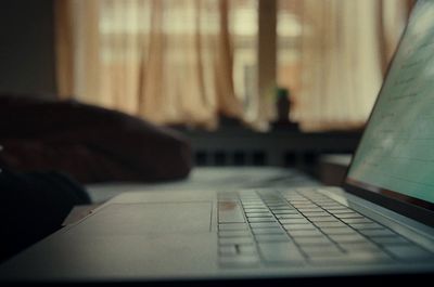 a laptop computer sitting on top of a desk