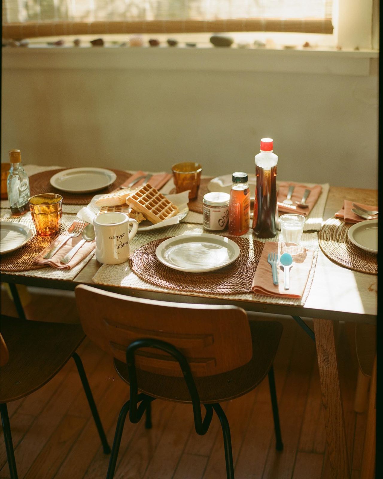 a table with plates, cups, and saucers on it