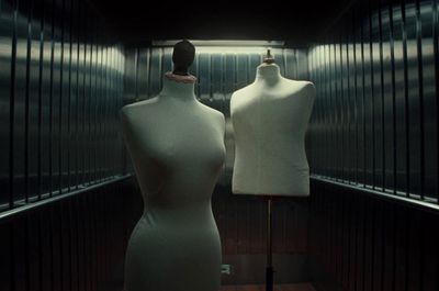 a couple of mannequins that are standing in a room