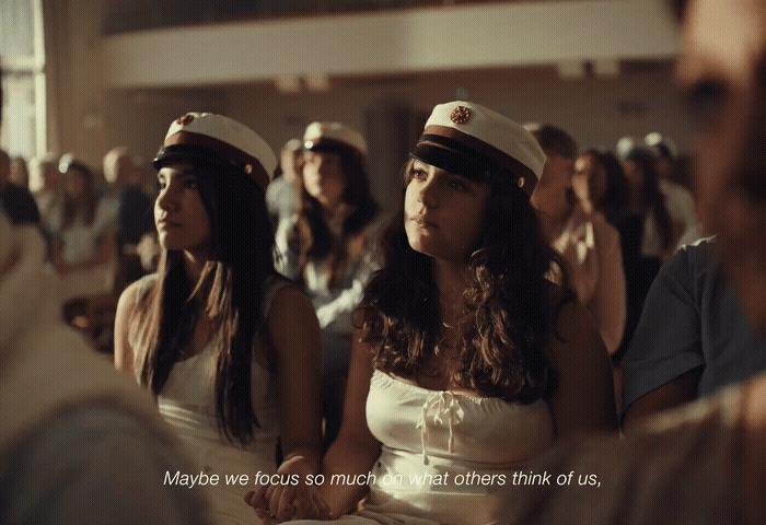 a group of women sitting next to each other