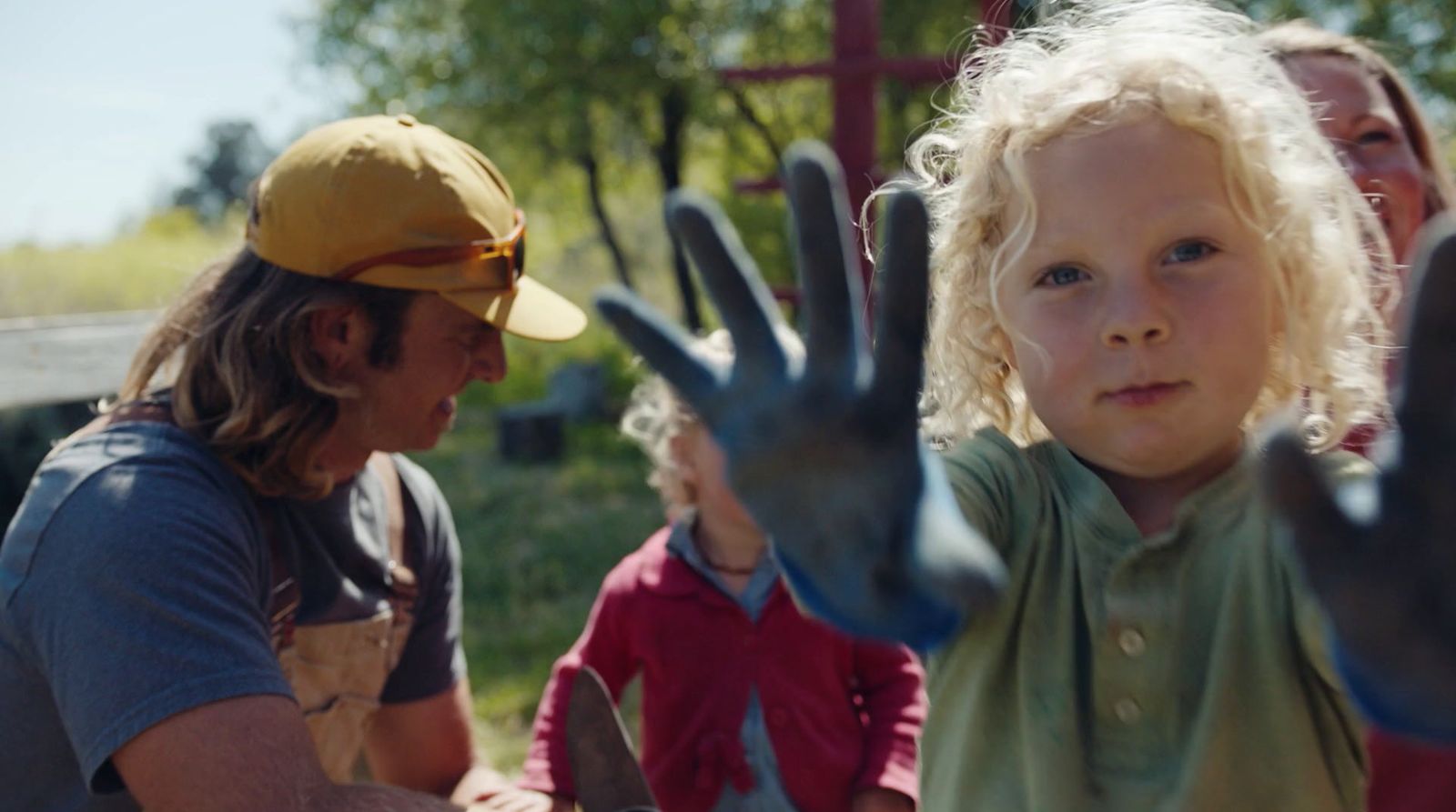 a little girl with her hands in the air