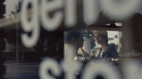 a couple of people that are looking in a mirror