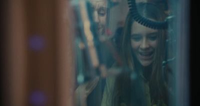 a woman with a blow dryer on her head