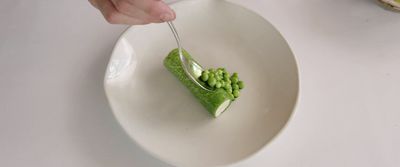 a white plate topped with a piece of green cake