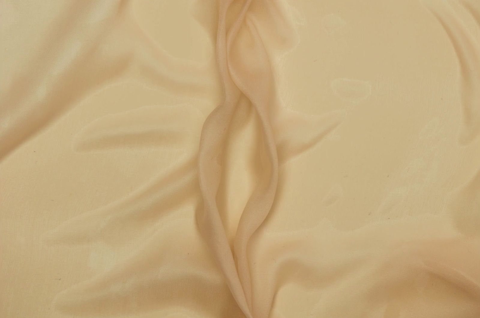 a close up of a bed with a white sheet