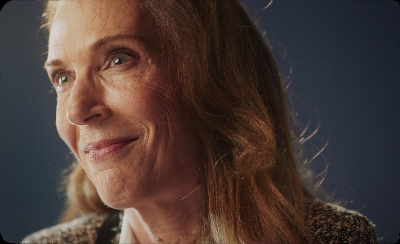 a close up of a person with long hair