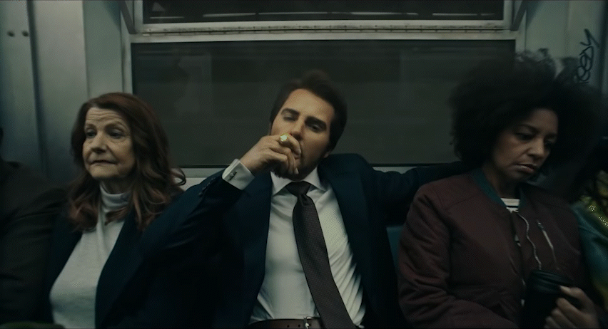 a group of people sitting next to each other on a train