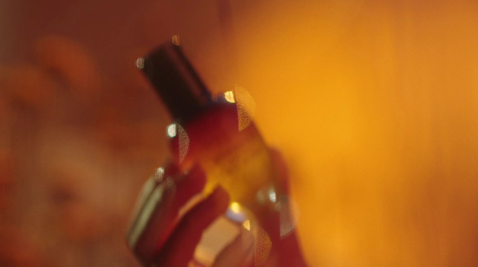 a close up of a wine bottle with a blurry background