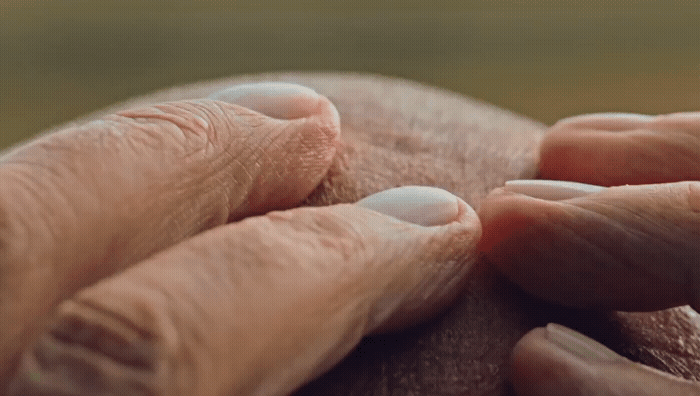 a close up of two hands touching each other