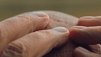 a close up of two hands touching each other
