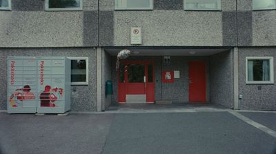 a building with a red door and a red door