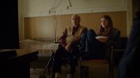 a man and a woman sitting in a room