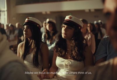 a group of women sitting next to each other