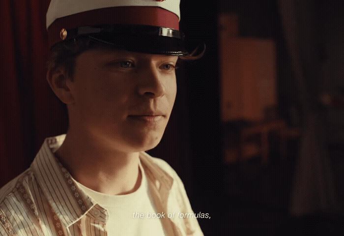 a man wearing a red and white hat