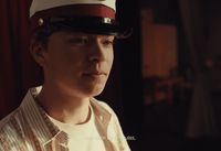 a man wearing a red and white hat