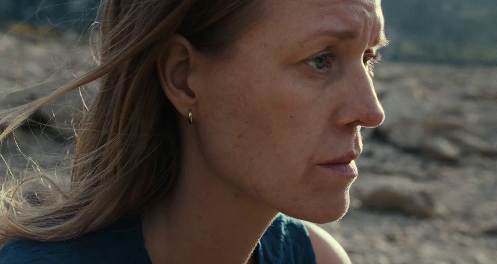a close up of a woman with a concerned look on her face