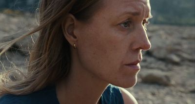 a close up of a woman with a concerned look on her face