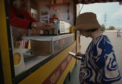 a man standing in front of a food truck