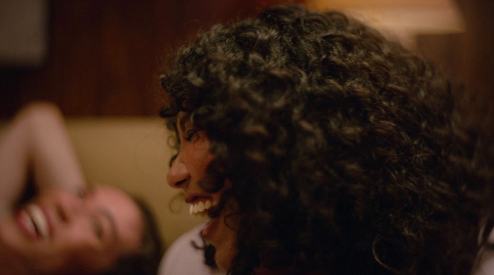 a close up of a person with curly hair