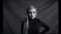 a black and white photo of a woman with long hair