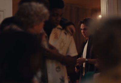 a group of people standing around each other