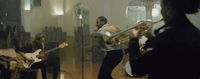 a group of people playing instruments in a room