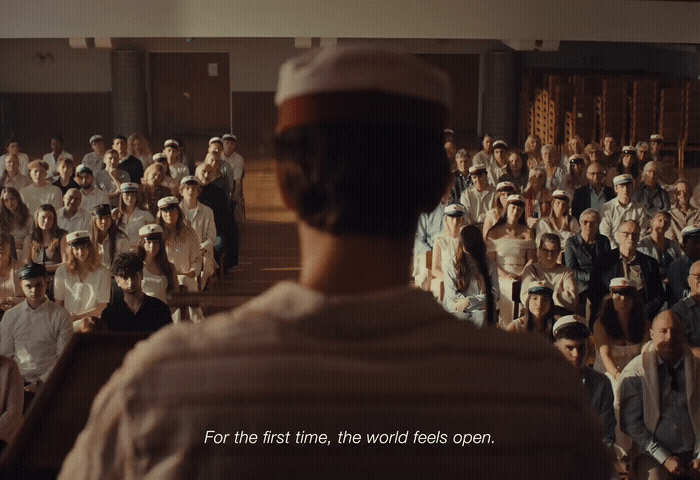a man standing in front of a crowd of people