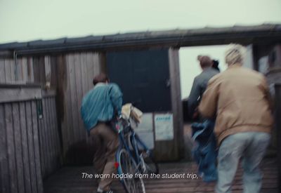 a blurry photo of a person walking a bike