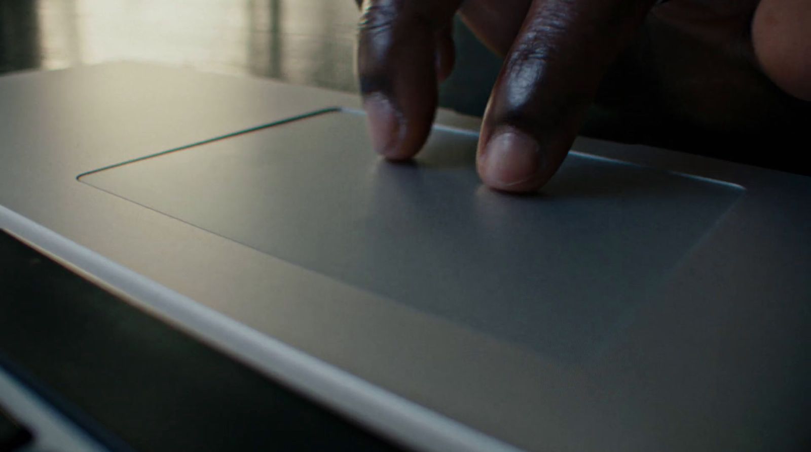 a close up of a person typing on a laptop