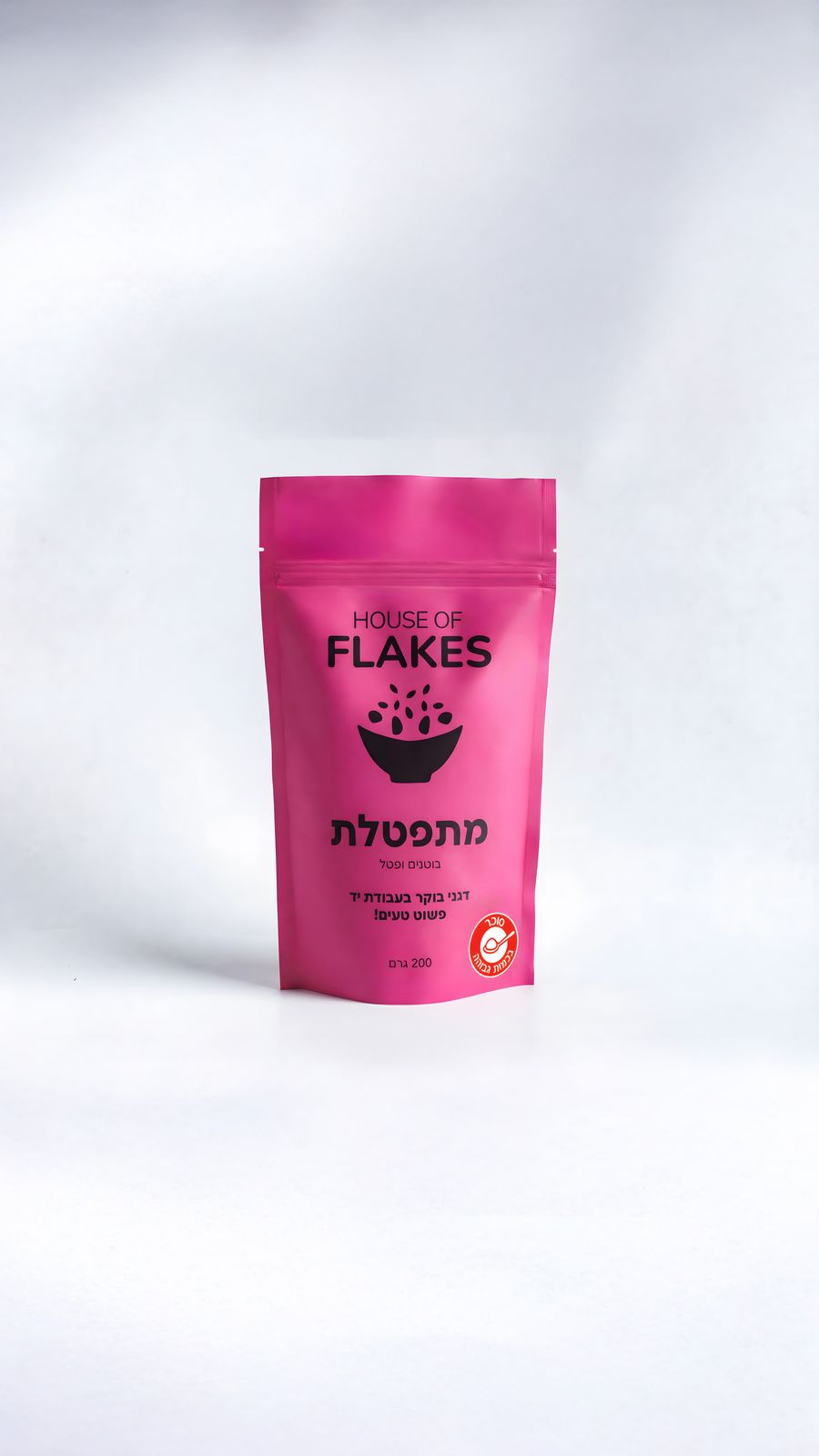 a pink bag of flakes on a white background
