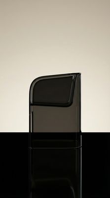 a black chair sitting on top of a black table