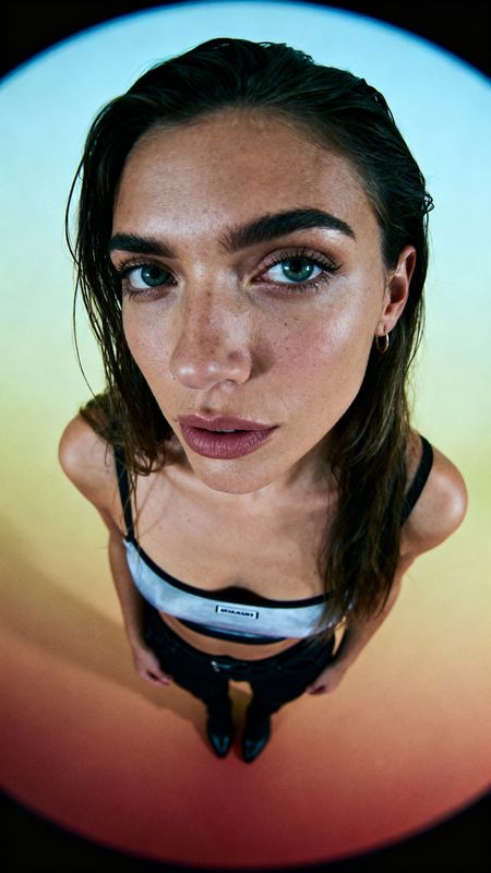 a woman with blue eyes and a bike helmet