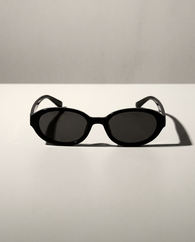 a pair of sunglasses sitting on top of a table