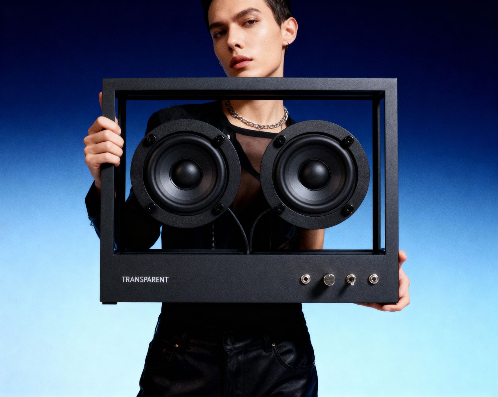 a woman holding a speaker in front of her face