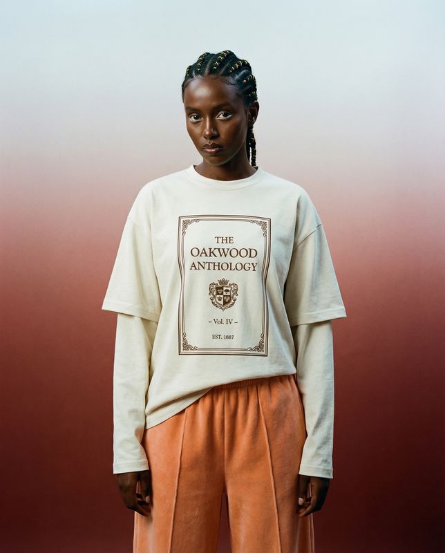 a woman standing in front of a red and white background