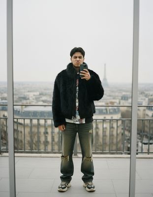 a man taking a picture of himself in a mirror