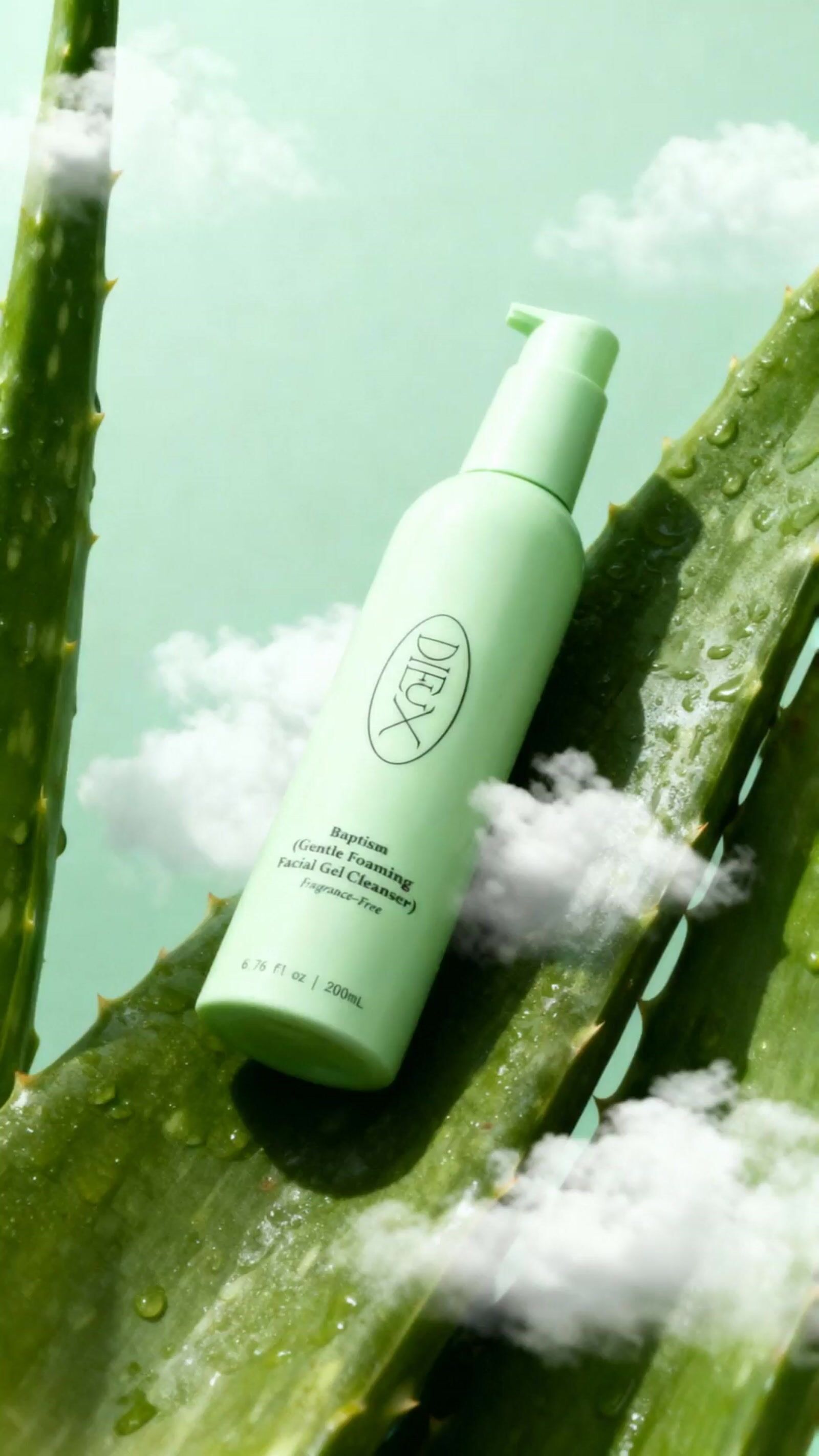 a bottle of deodorant sitting on top of a plant