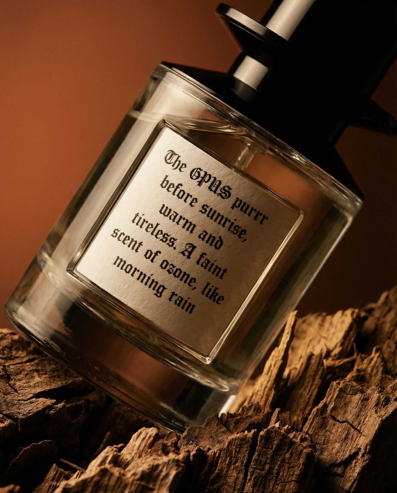 a bottle of perfume sitting on top of a wooden table