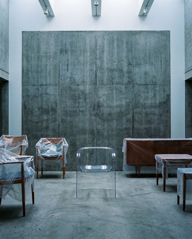 a group of chairs and tables in a room