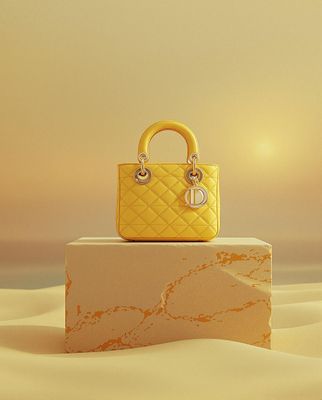 a yellow purse sitting on top of a white block