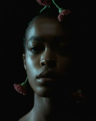 a woman with flowers in her hair