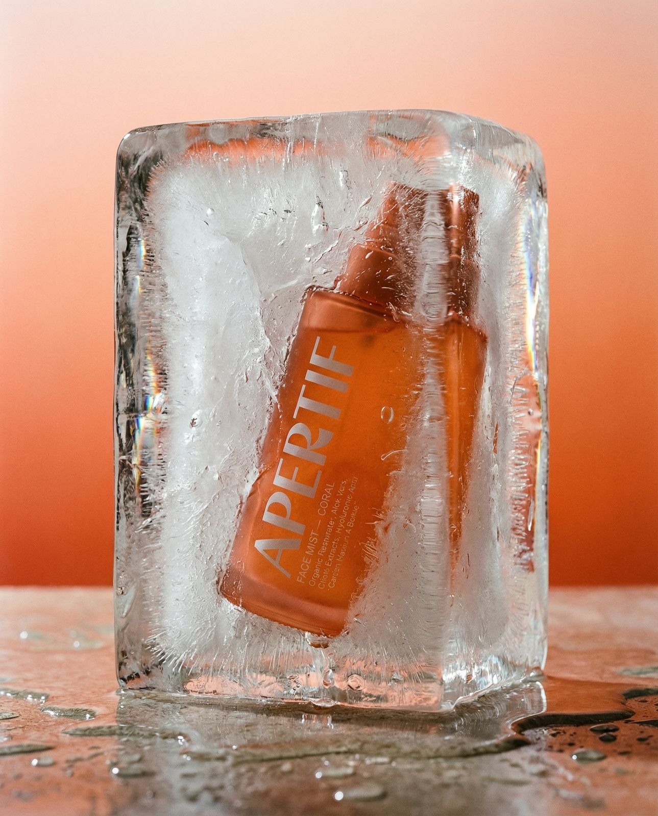a bottle of apricot sitting on top of an ice block