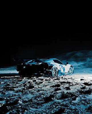 a car is parked in the middle of the desert