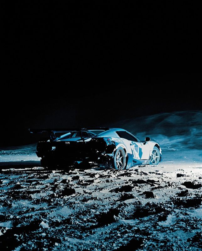 a car is parked in the middle of the desert