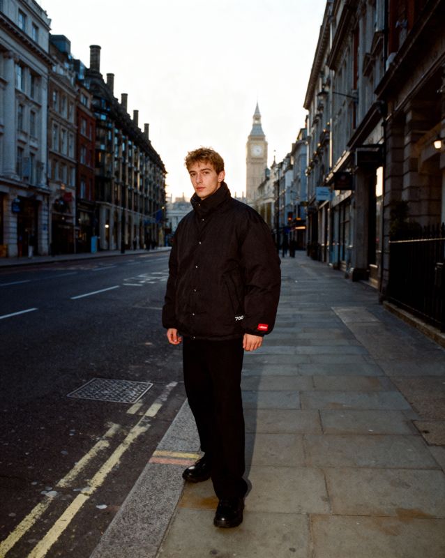 a man standing on the side of a street