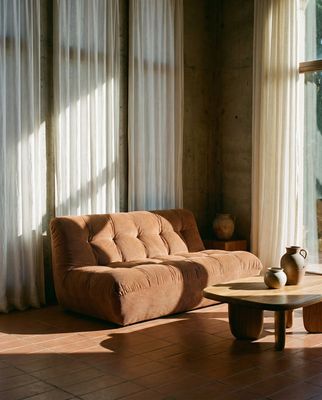 a living room with a couch and a table