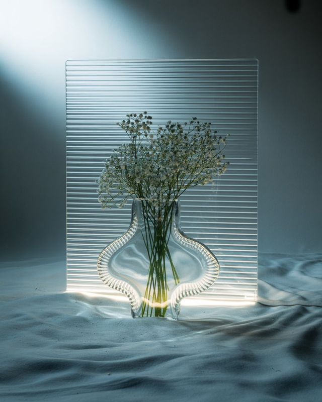 a vase filled with flowers sitting on top of a table