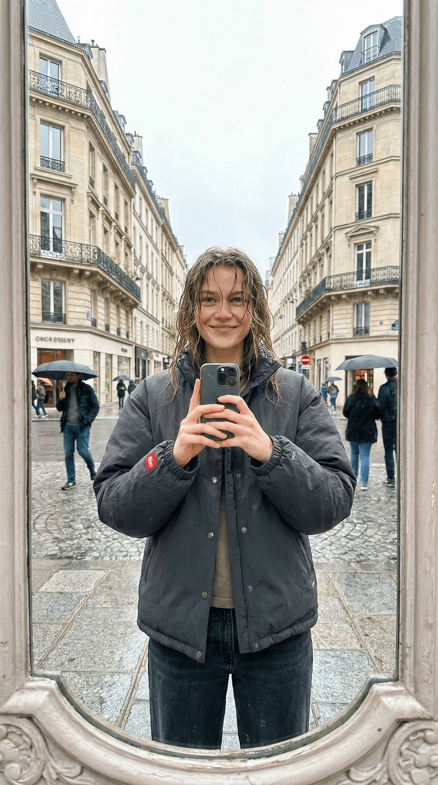 a woman taking a selfie in front of a mirror